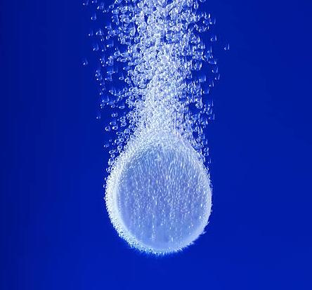 hydrogen tablet in water with bubbles